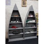 PAIR OF BOAT SHAPED BOOKSHELVES