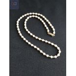 9 CARAT GOLD CLASPED PEARLS