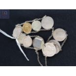 ANTIQUE COIN CHARM BRACELET TO INCLUDE 1856 GOLD DOLLOR