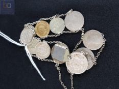 ANTIQUE COIN CHARM BRACELET TO INCLUDE 1856 GOLD DOLLOR