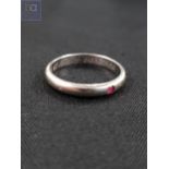 CONTINENTAL WHITE GOLD AND RUBY WEDDING BAND POSSIBLY 14 CARAT 2.6 GRAMS