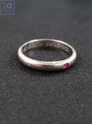 CONTINENTAL WHITE GOLD AND RUBY WEDDING BAND POSSIBLY 14 CARAT 2.6 GRAMS