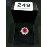 SILVER CUBIC ZIRCONIA AND RED STONE RING