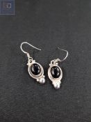 PAIR OF SILVER AND ONYX SET EARRINGS