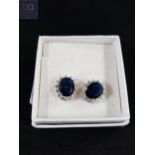 PAIR OF CRYSTAL AND BLUE STONE CLUSTER EARRINGS