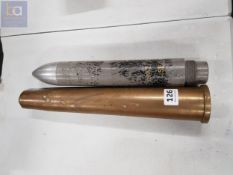 OLD MISSILE HEAD AND BRASS SHELL