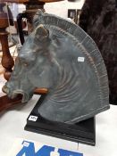 A VINTAGE BRASS PAINTED HORSE HEAD