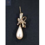 YELLOW METAL PEARL AND WHITE SAPPHIRE BROOCH