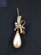 YELLOW METAL PEARL AND WHITE SAPPHIRE BROOCH