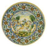 A large Central Italy white and polychrome maiolica plate, dated 1563