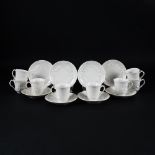 3 white porcelain coffee cups and saucer