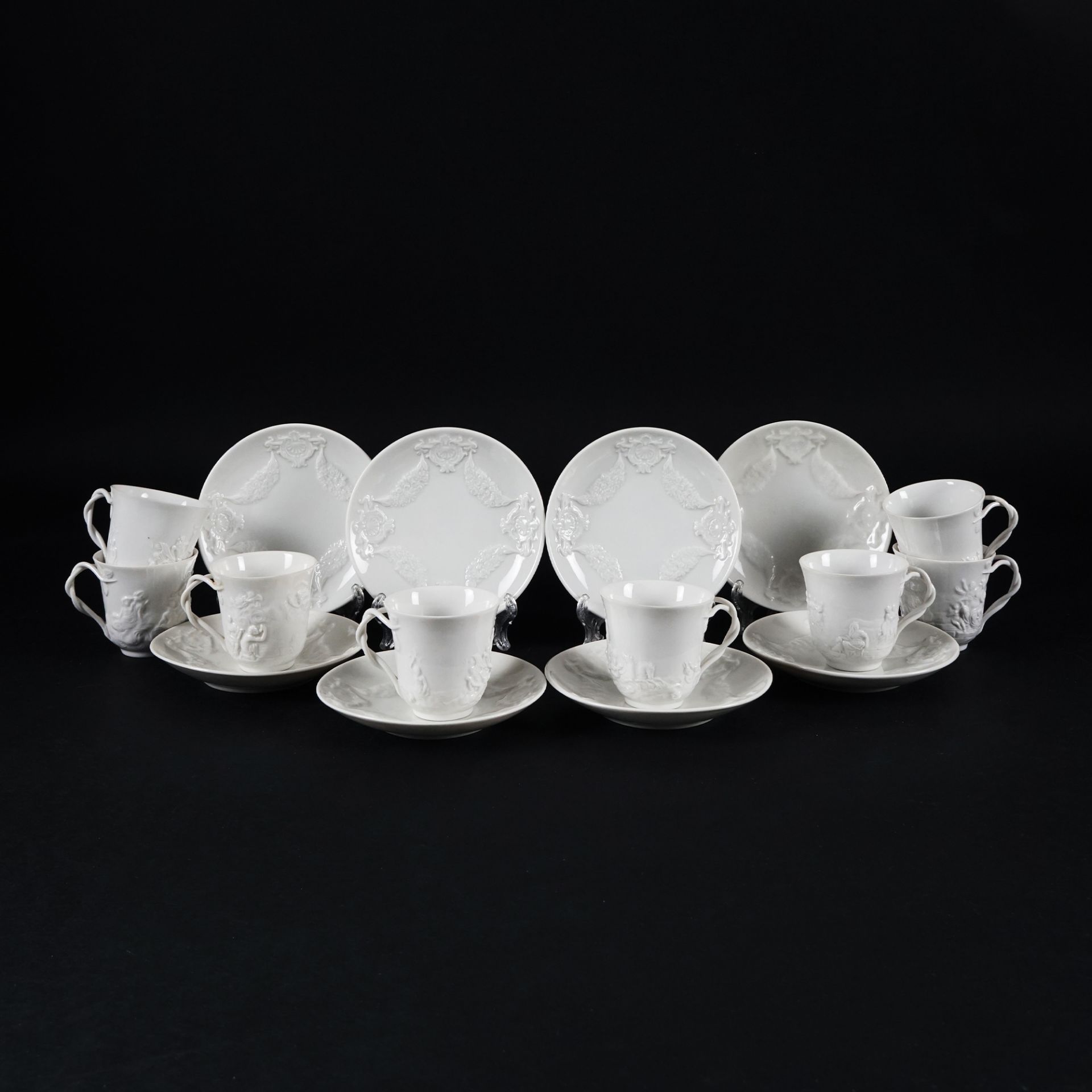 3 white porcelain coffee cups and saucer
