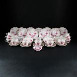 A Meissen white and deep pink porcelain part of a tea service