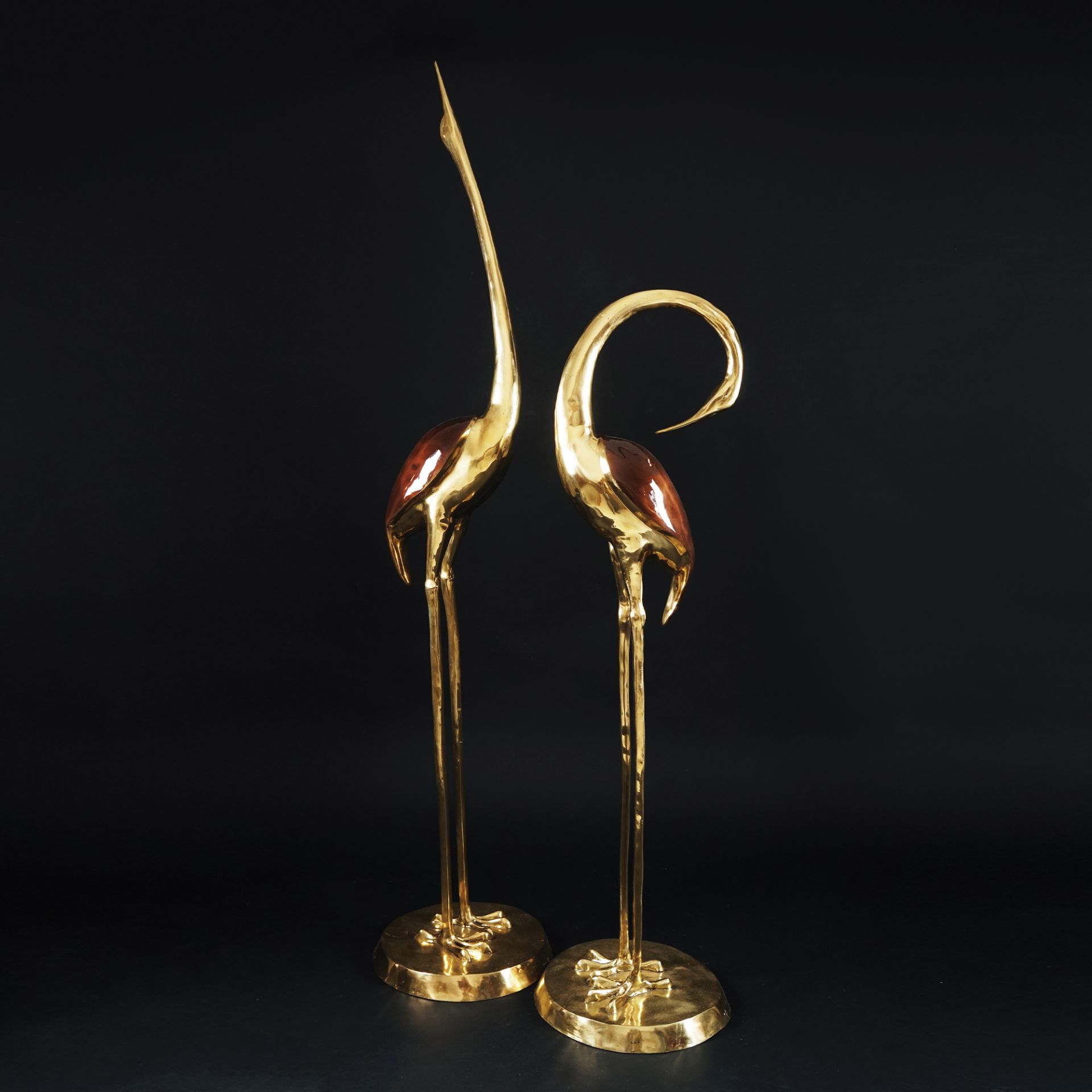 2 patinated and gilt bronze figures of an heron