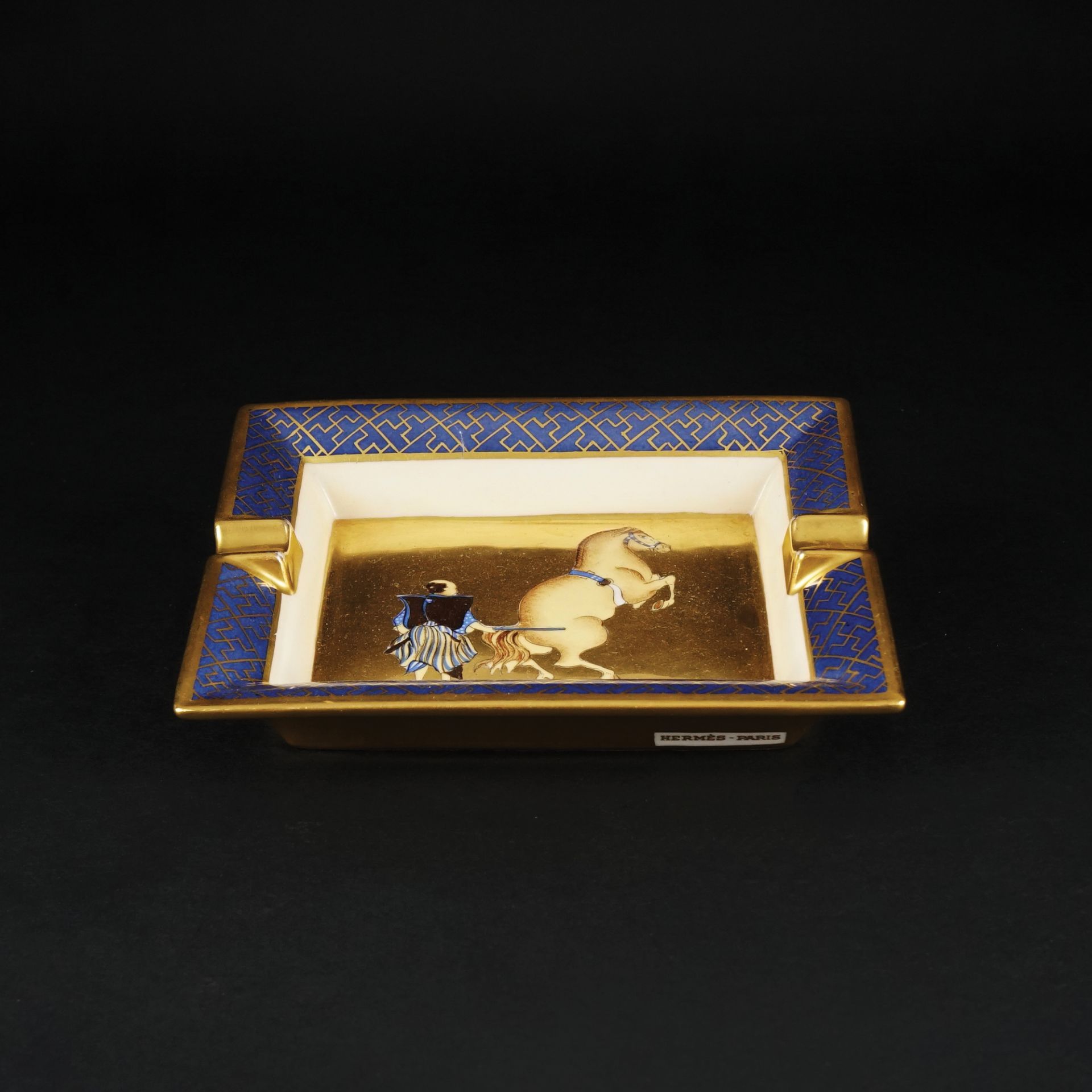 An Hermès gilt and polychrome porcelain Samourai au Dressage ashtray