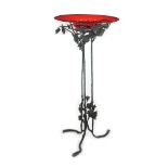 A wrought iron and Murano red glass tripod in the style of Umberto Bellotto