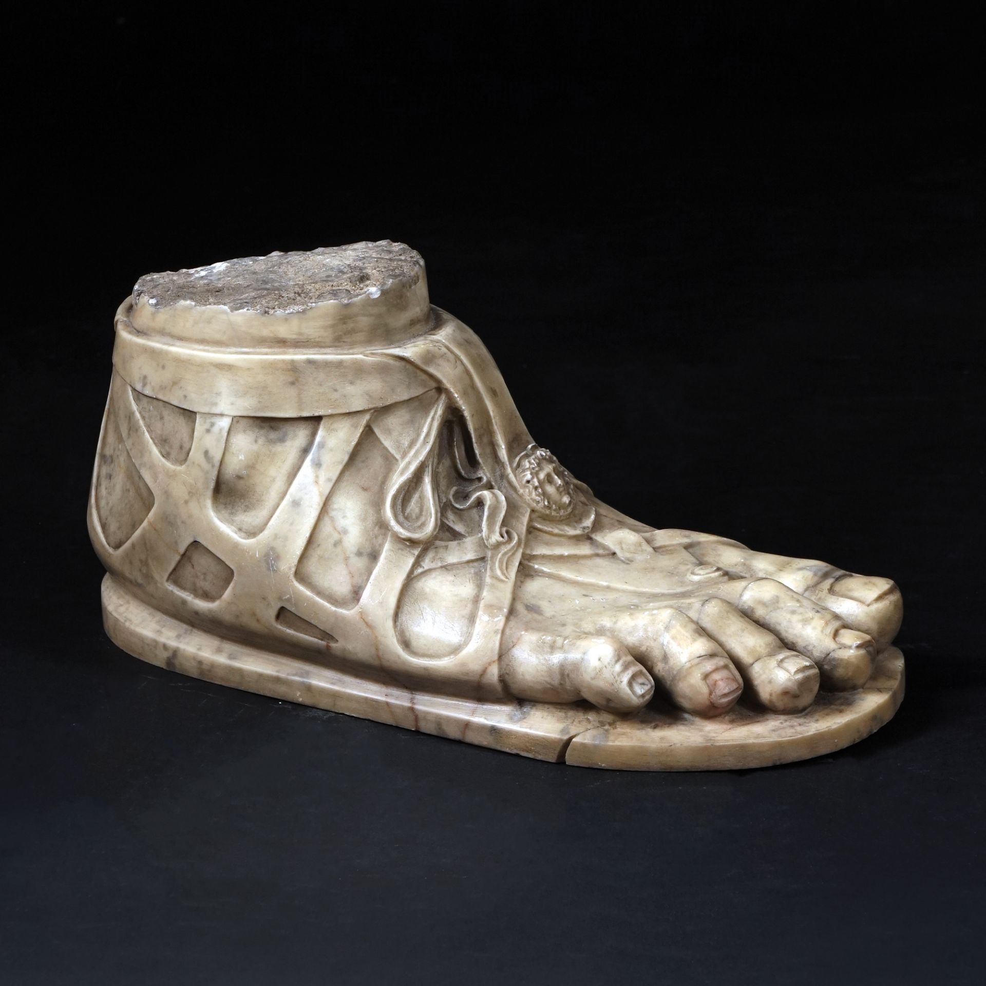 A white marble foot with shod