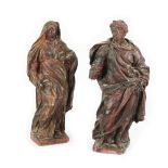 A pair of patinated plaster figures of The Virgin and Saint John, 18th century