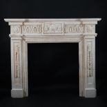 A carved white marble fireplace in Louis XVI style