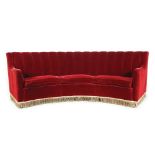 A red velvet coated arched line sofa