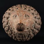 A carved rosso di Verona marble lion head