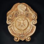A carved marble coat of arm