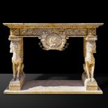 A richly carved marble fireplace