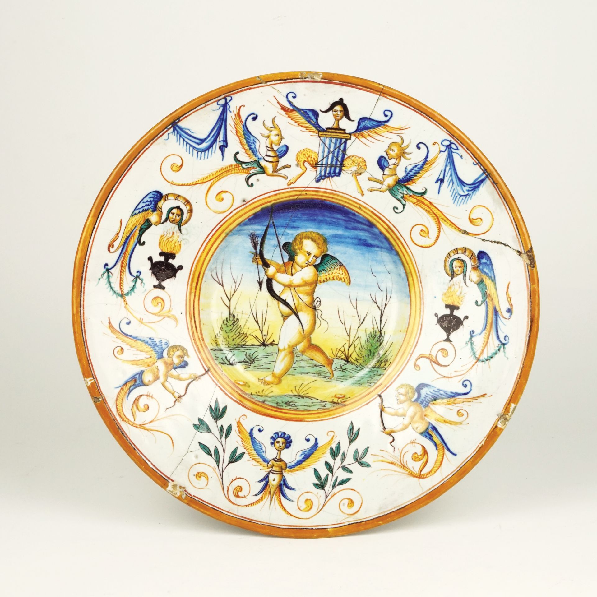 An IOtalian white and polychrome maiolica plate, Pesaro, late 19th century