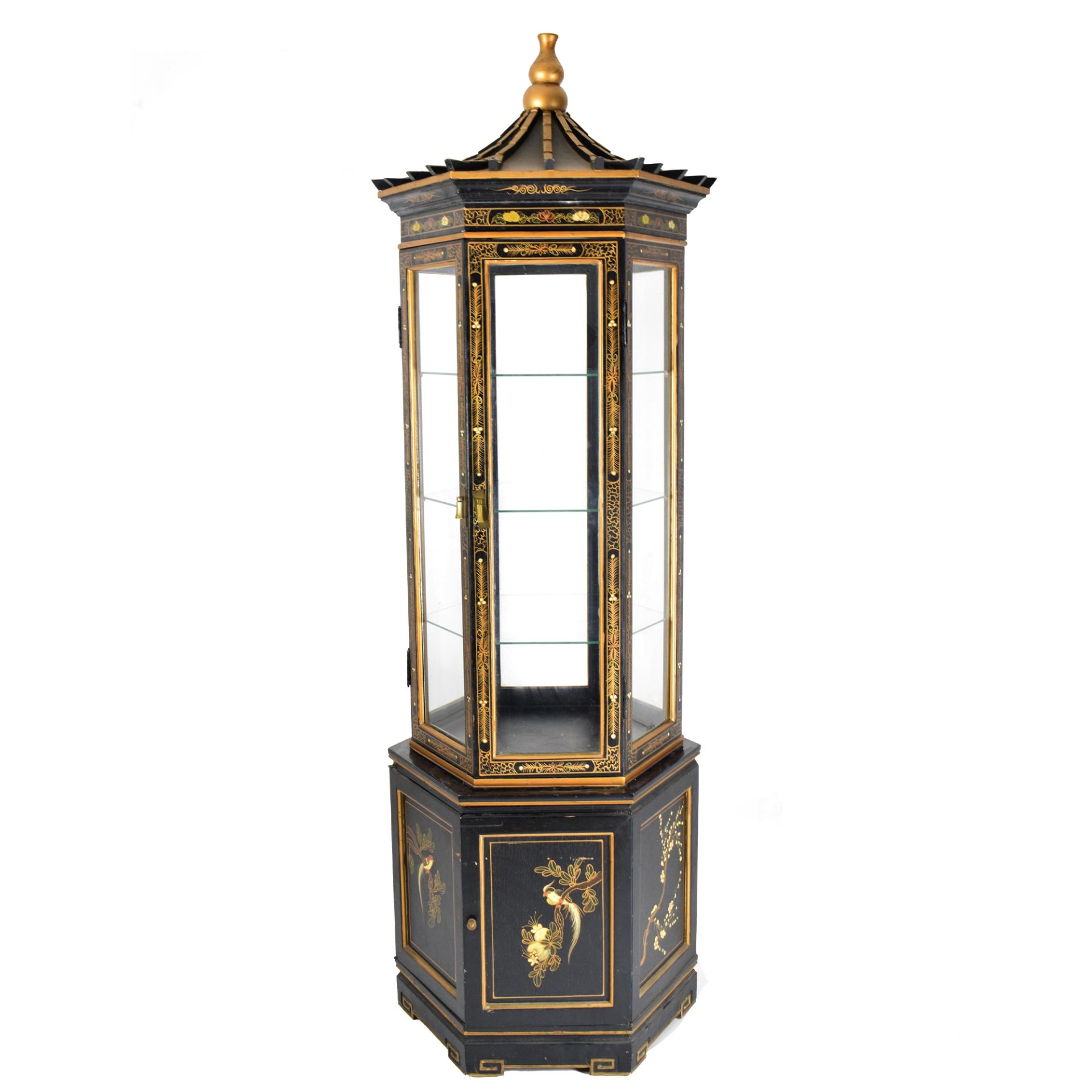 An ebonized and gilt wood center pagoda vitrine