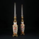 A pair of Chinese lamp mounted polychrome porcelain vases, end of 19th century