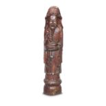 A CHINESE RED LACQUER CARVED ELM FIGURE OF SHOU LAO Late 19th/early 20th century