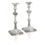 A PAIR OF GEORGE III CAST SILVER CANDLESTICKS Maker's mark DB, probably by David Bell, London 176...