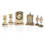 AN EARLY 19TH CENTURY FRENCH CHAMPLEV&#201; ENAMEL AND BRASS CLOCK GARNITURE Retailed by E Polland 6