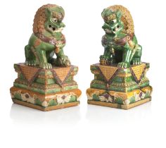A PAIR OF LARGE POTTERY BUDDHISTIC LIONS 20th century (2)