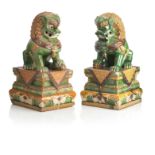 A PAIR OF LARGE POTTERY BUDDHISTIC LIONS 20th century (2)