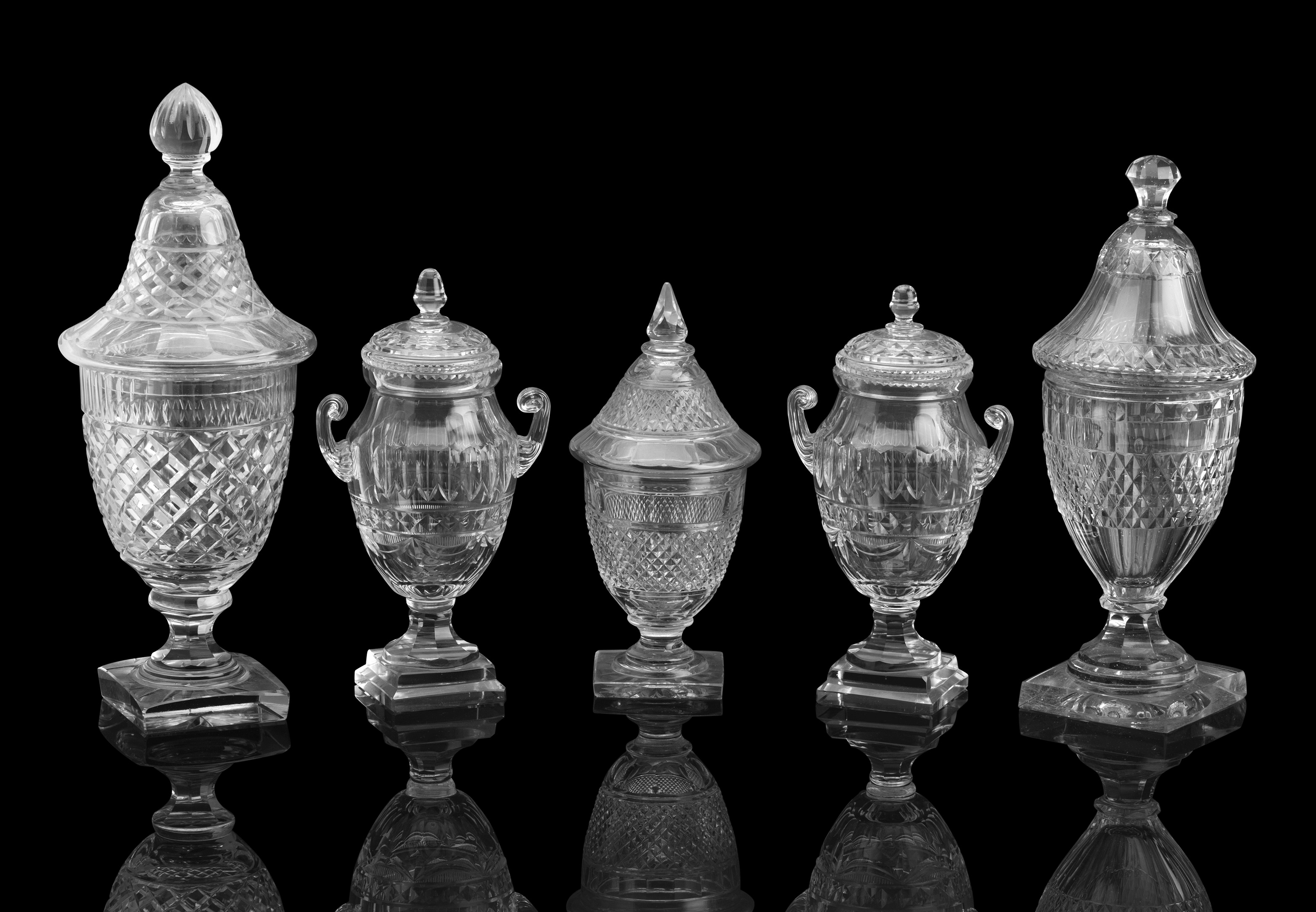 A GROUP OF GEORGE III STYLE COVERED URNS