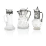 THREE LATE VICTORIAN SILVER-MOUNTED CLARET JUGS The first by Robert and Belk, Sheffield 1898 (3)