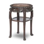 A 19TH CENTURY CHINESE ROUGE MARBLE AND HARDWOOD JARDINIERE STAND