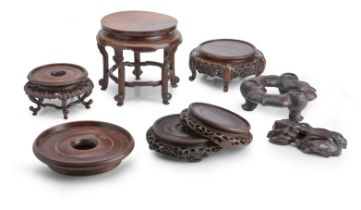 A GROUP OF EIGHT CHINESE HARDWOOD STANDS (8)
