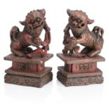 A PAIR OF CHINESE CARVED WOOD AND LACQUER BUDDHIST LION DOGS 19th century (2)