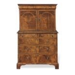 A late 17th/early 18th century walnut and featherbanded cabinet on chest the William and Mary cab...