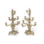 A pair of late 18th / early 19th century Italian carved and giltwood eight light alter candelabra...