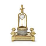 An early20th century French gilt bronze and grey marble novelty desk timepiece in the Louis XVI s...