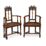 A pair of French 19th century Renaissance revival carved walnut caqueteuses or open armchairs (2)