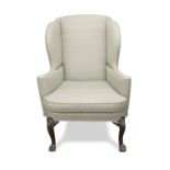 A George II walnut wingback armchair