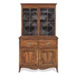 A George III mahogany and ebonised banded secretaire bookcase after designs by Thomas Sheraton