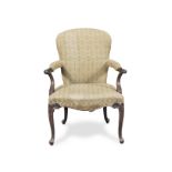A George III mahogany open armchair in the French taste