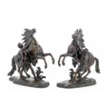 After Guillaume Coustou (French, 1677-1746): A PAIR OF late 19th century patinated bronze models ...