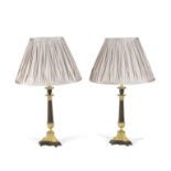 A pair of 19th century gilt and patinated bronze candlesticks later converted to lamp bases (4)