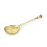 A 17th century silver-gilt seal top spoon probably West Country, bowl stamped with a stylised Tud...